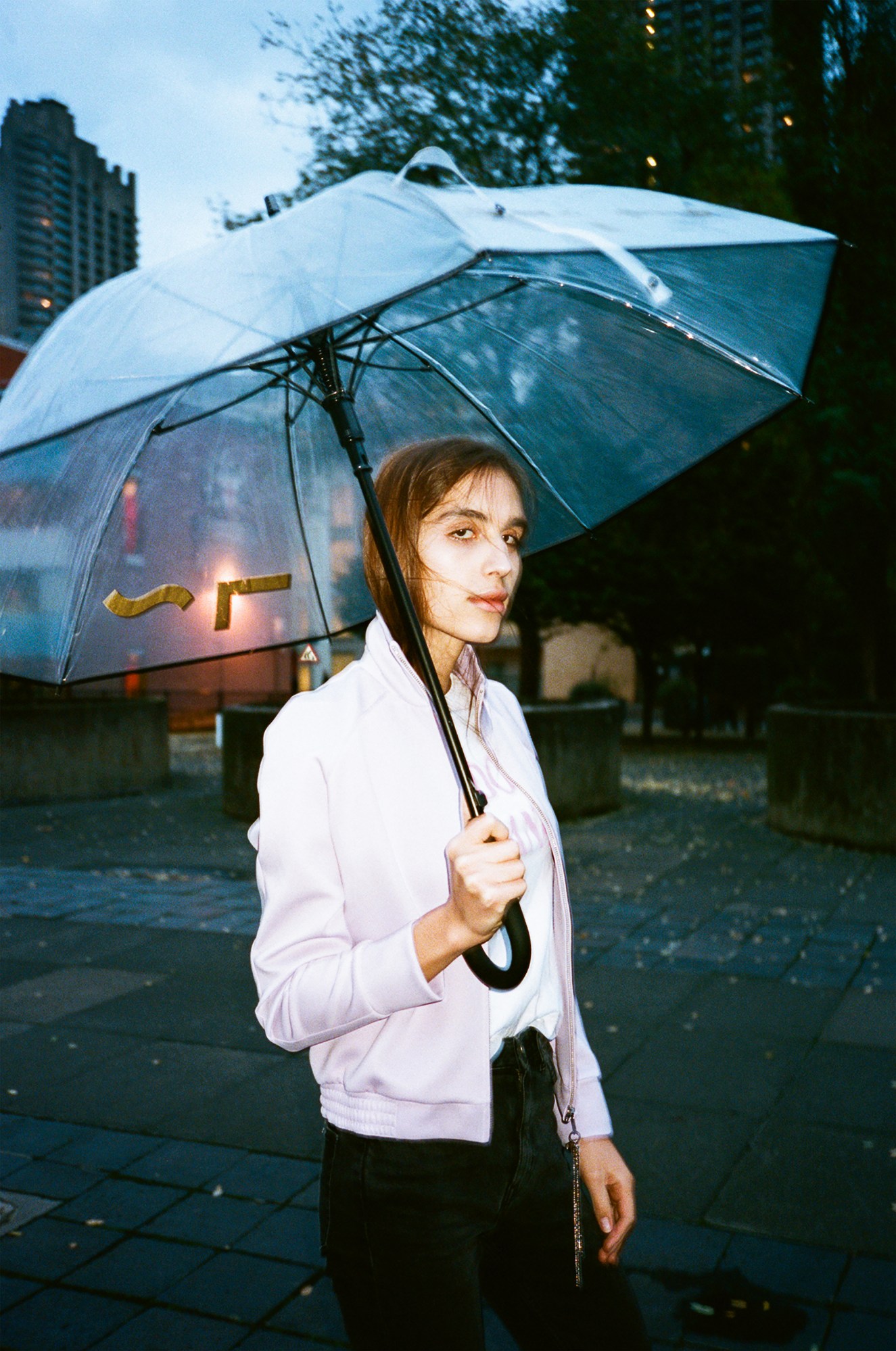 Trans model Maxim Magnus with an umbrella