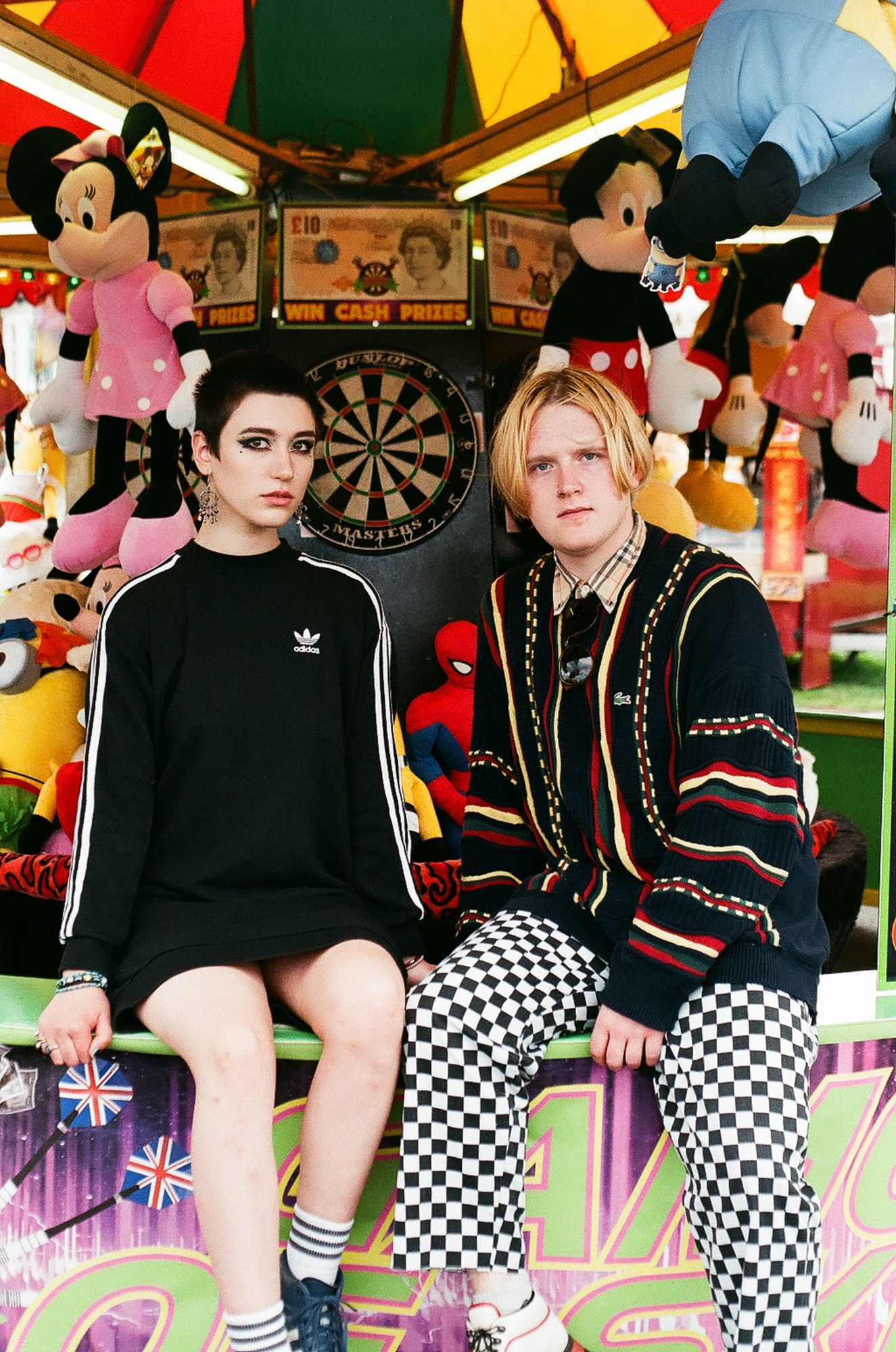 Newcastle youth photography: a couple in front of a carousel