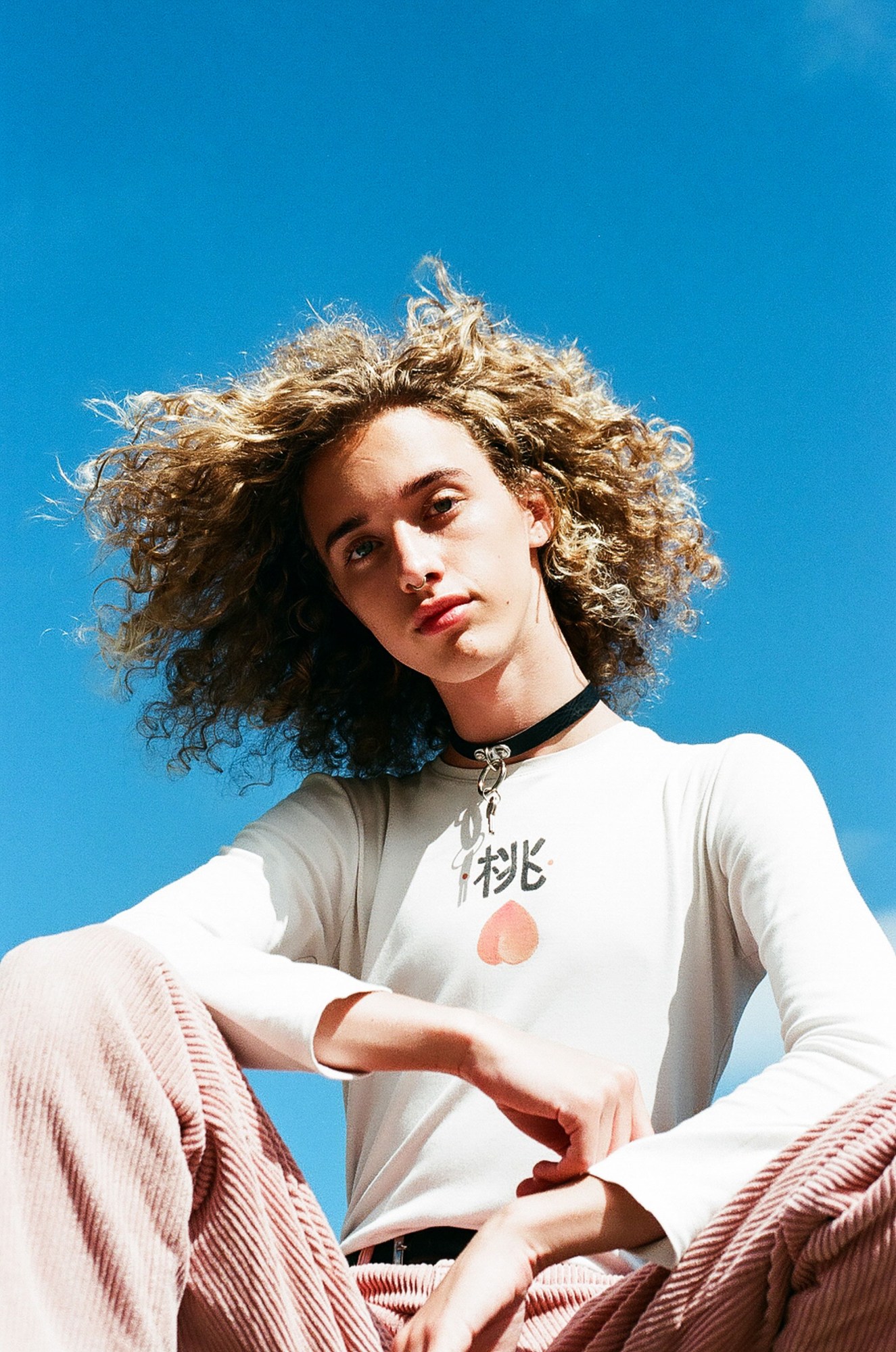 Newcastle youth photography: a woman with curly hair and a choker