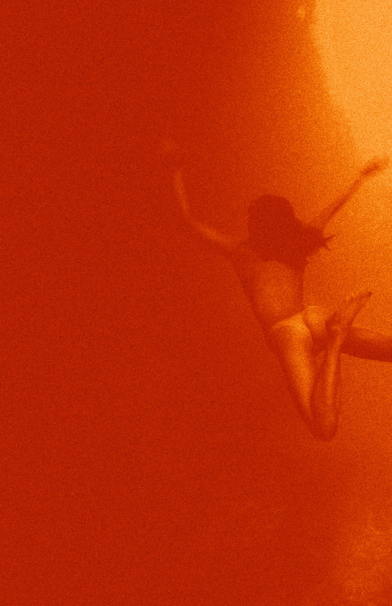 Kate Bellm photography: naked female swimmer underwater with orange filter