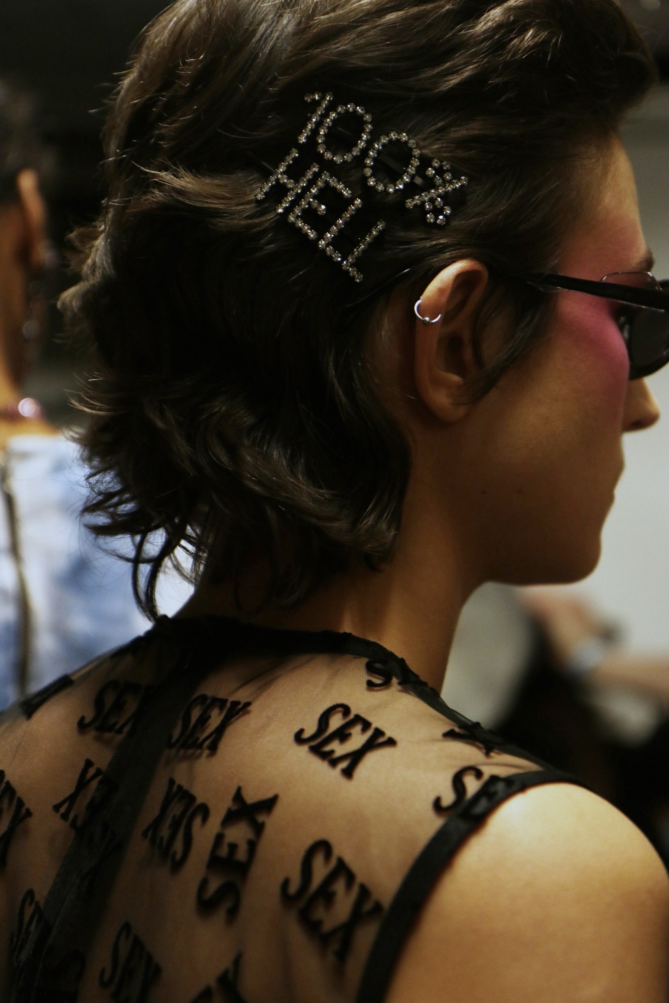 100% hell diamante hair accessory with sex mesh top at London Fashion Week