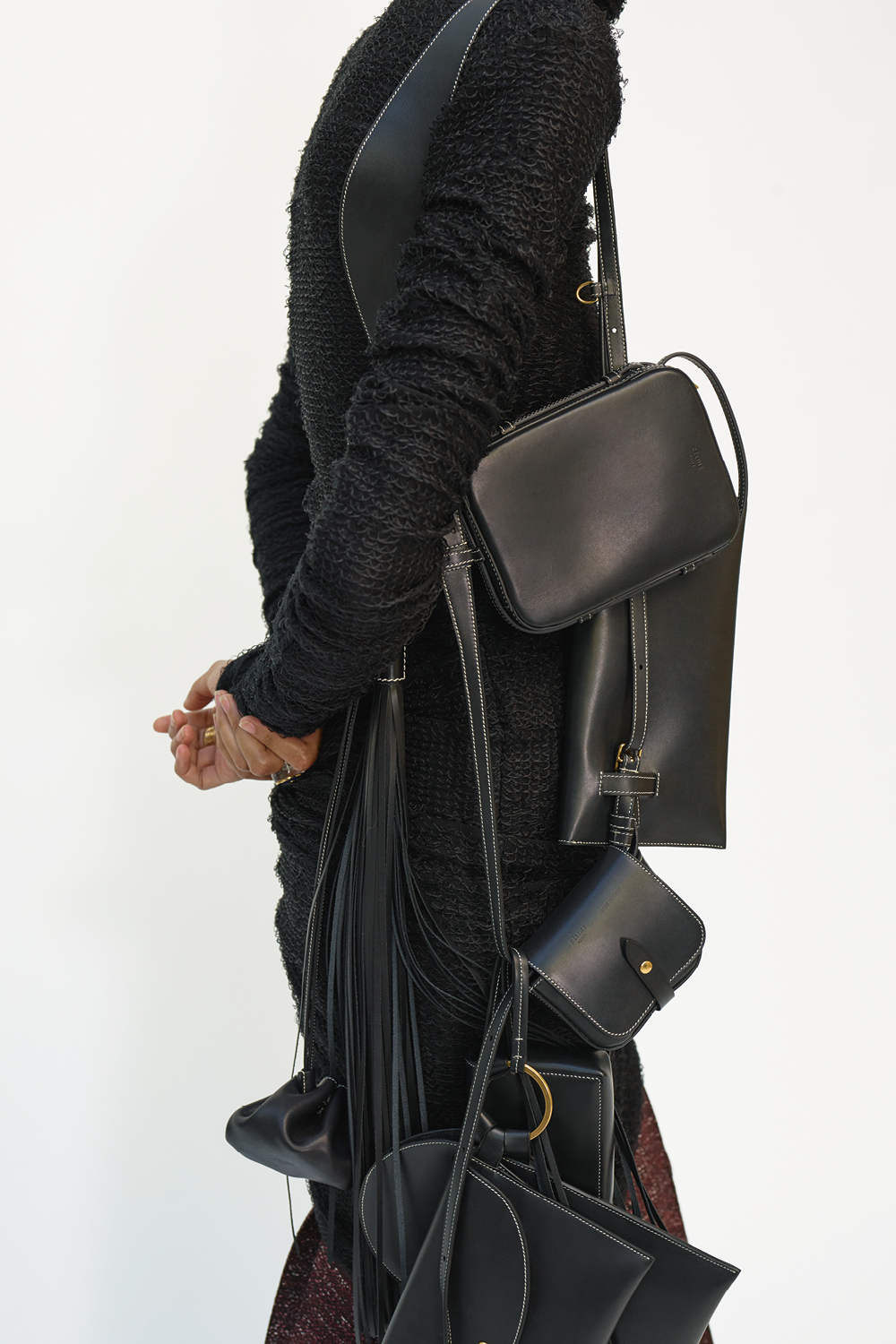 Phoebe Philo's final Céline collection: black handbags and a woollen coat