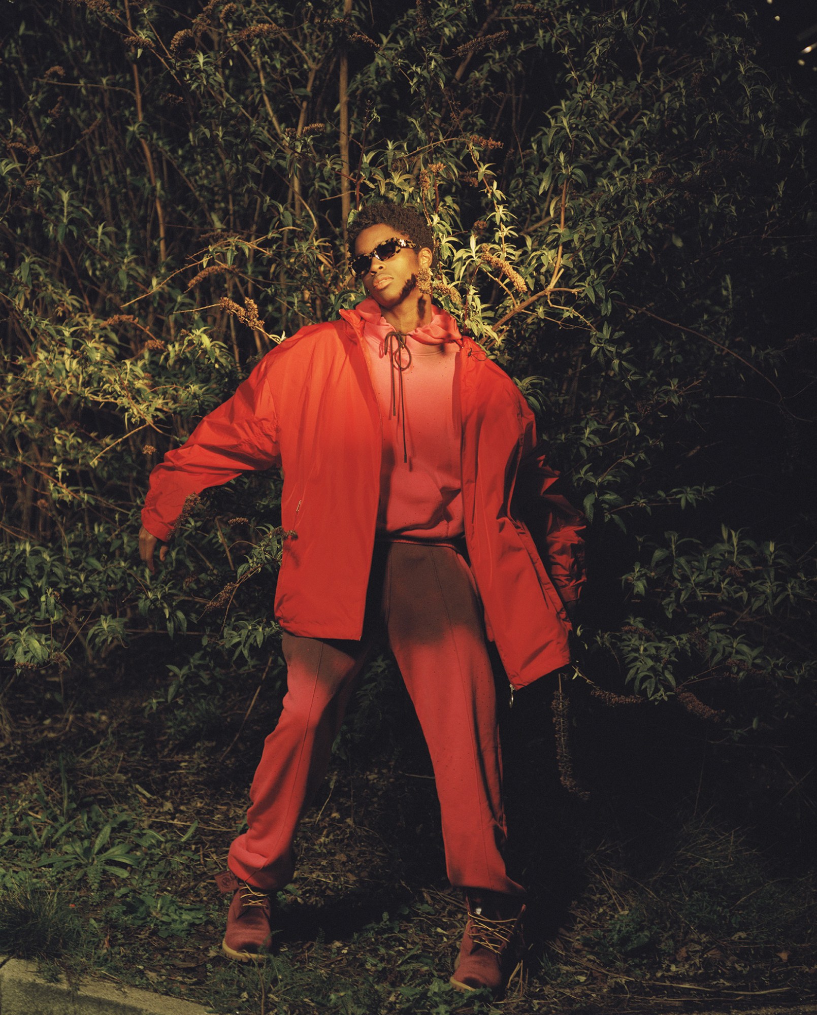 Model in orange red tracksuit for Virgil Abloh's off-white