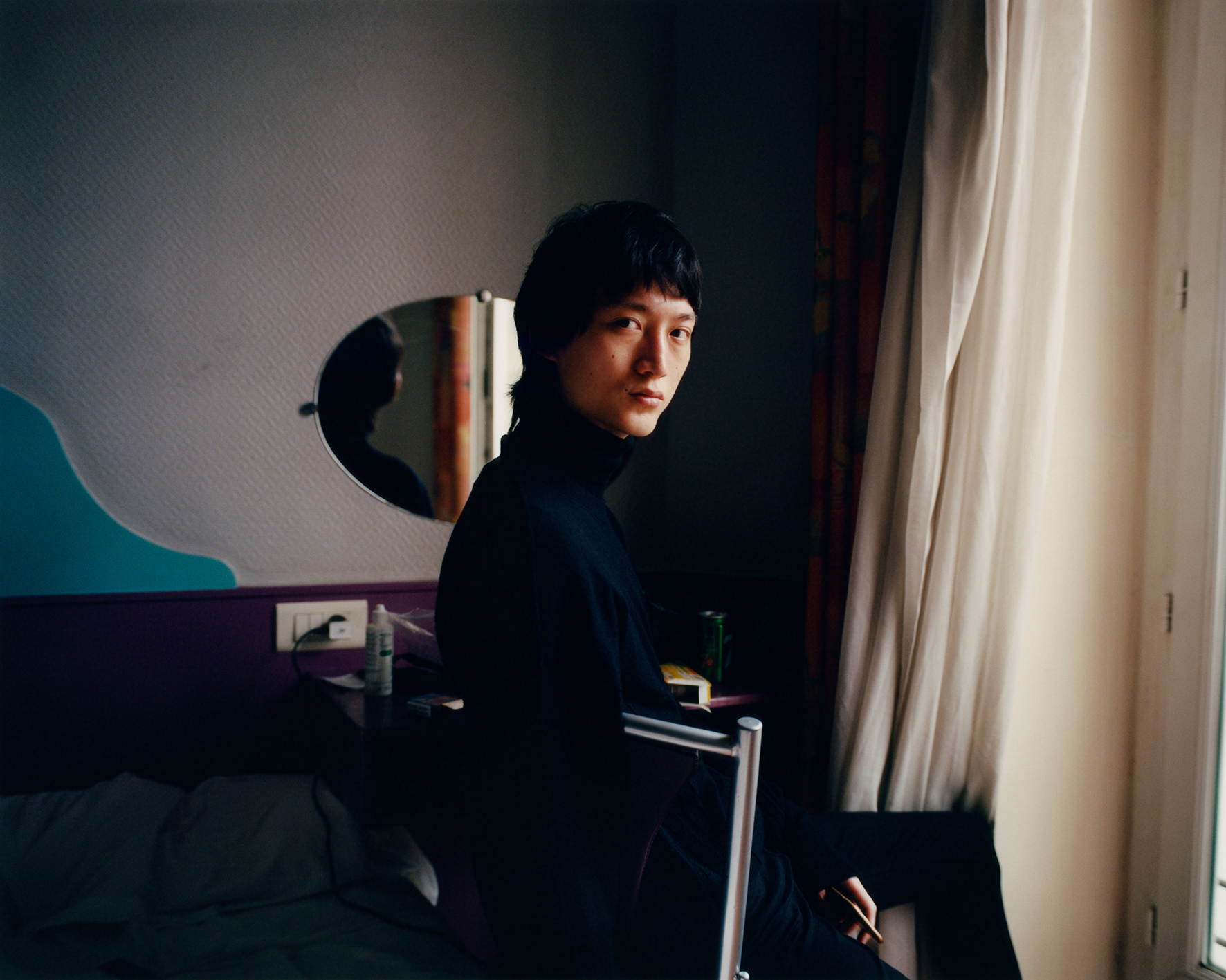 Male model in his bedroom