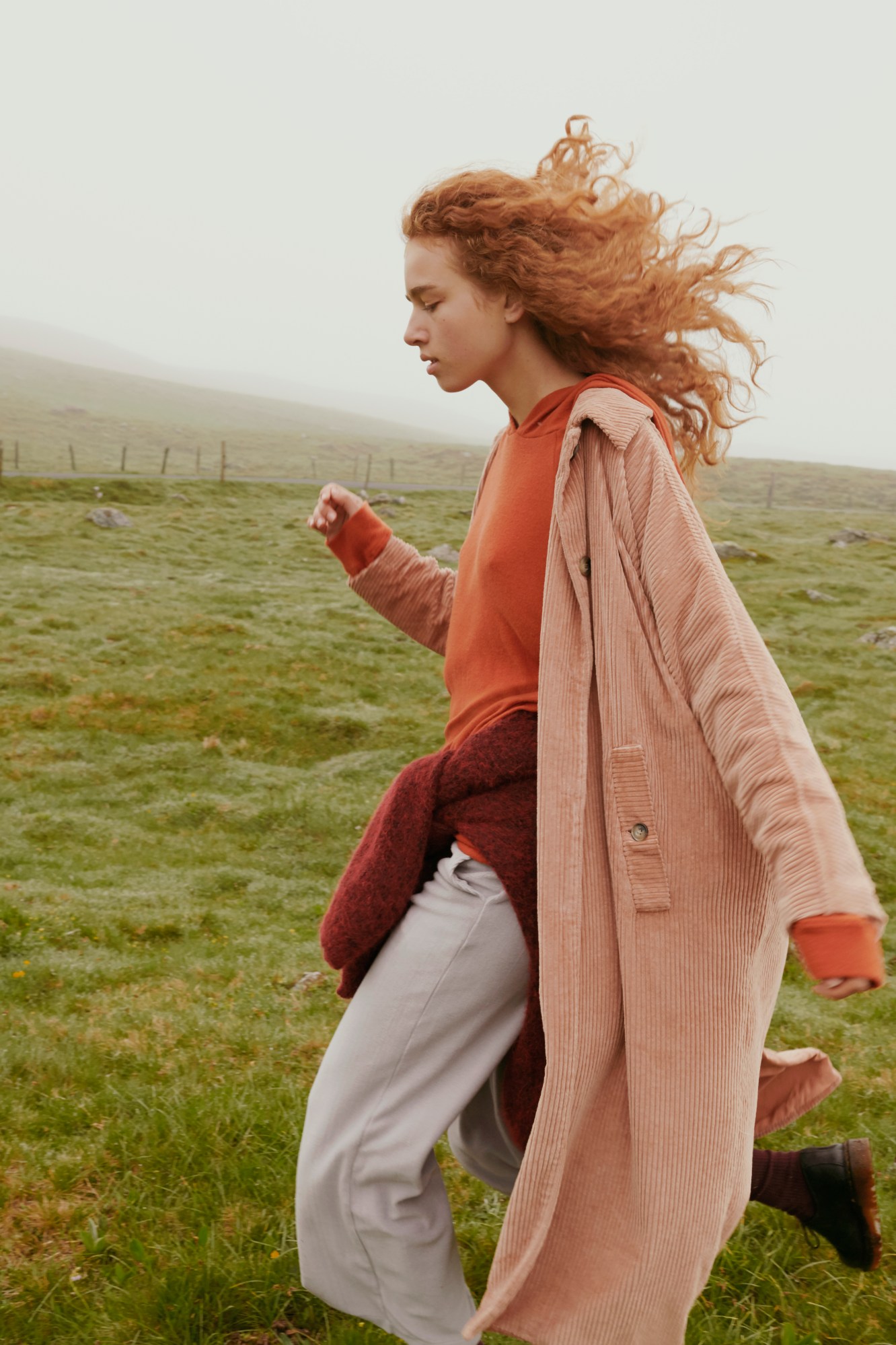 Woman in American Vintage campaign in field.