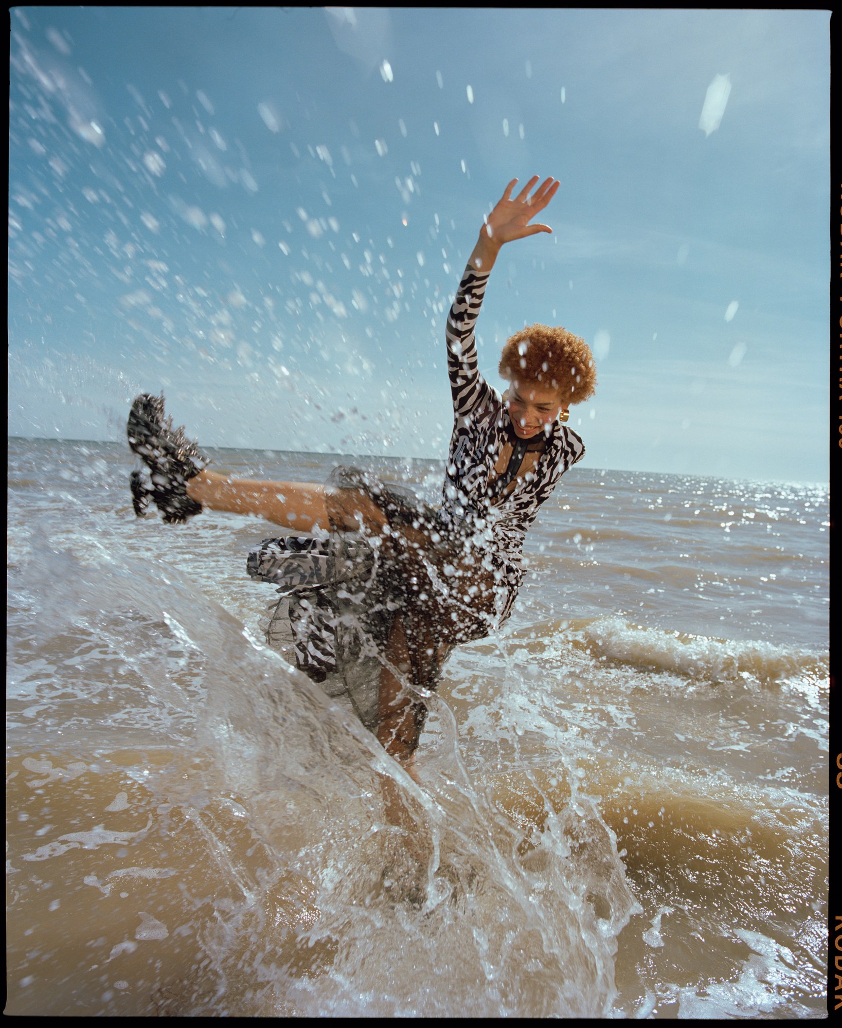 nadine ijewere photographs a model in the sea