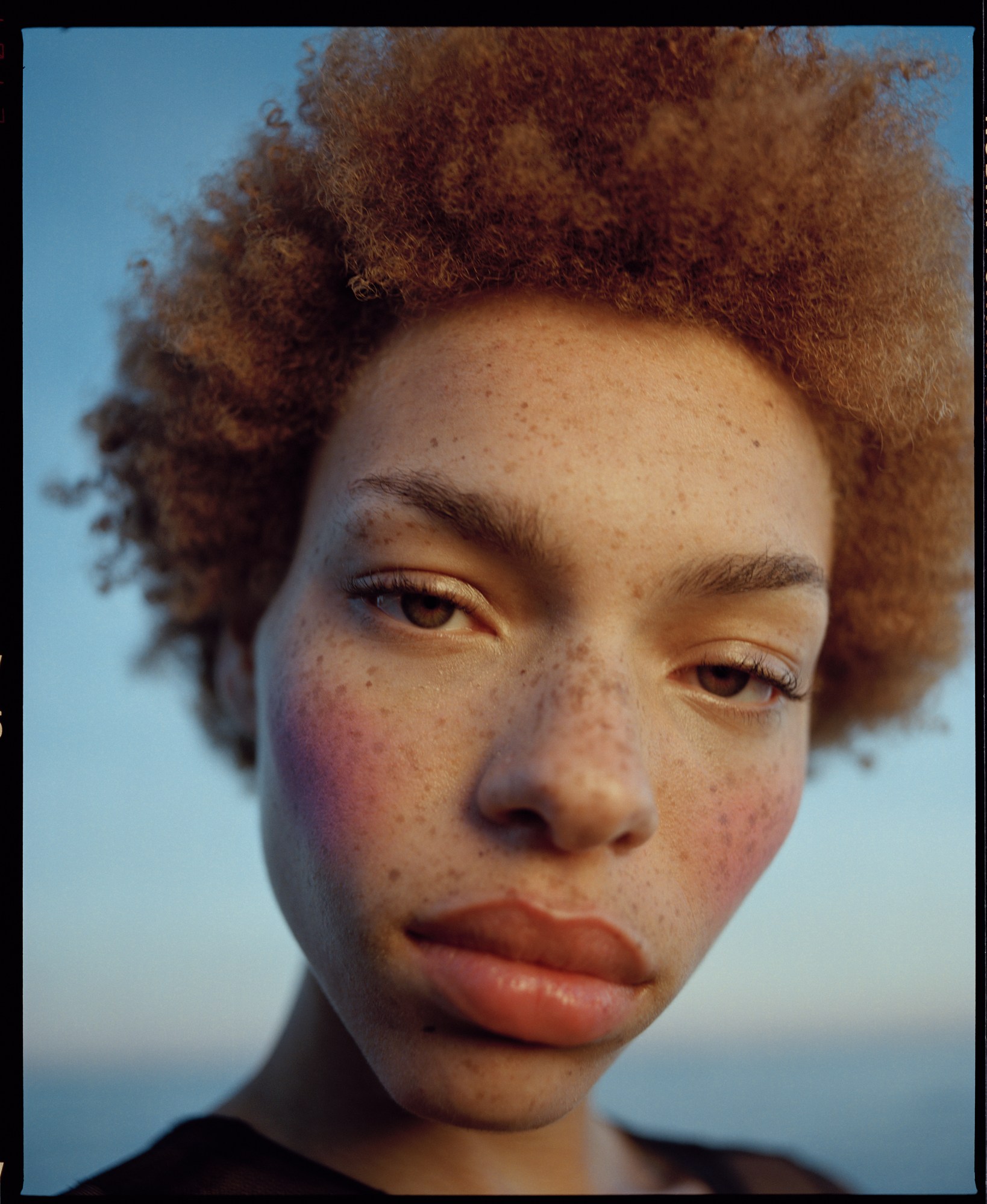 nadine ijewere shoots a model at the beach at sunset