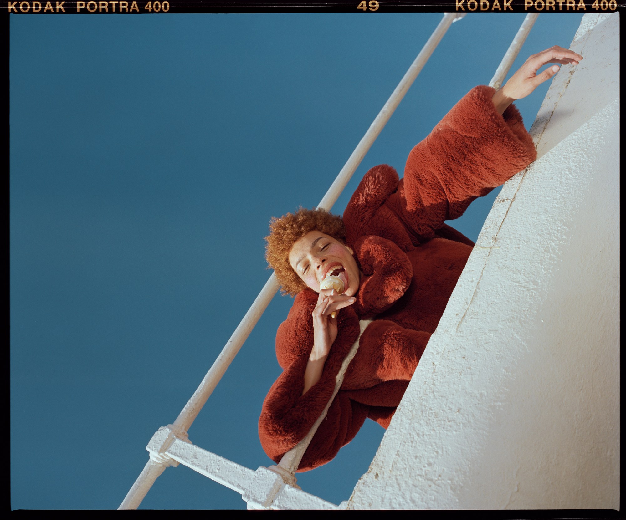 nadine ijewere photographs a model on a pier