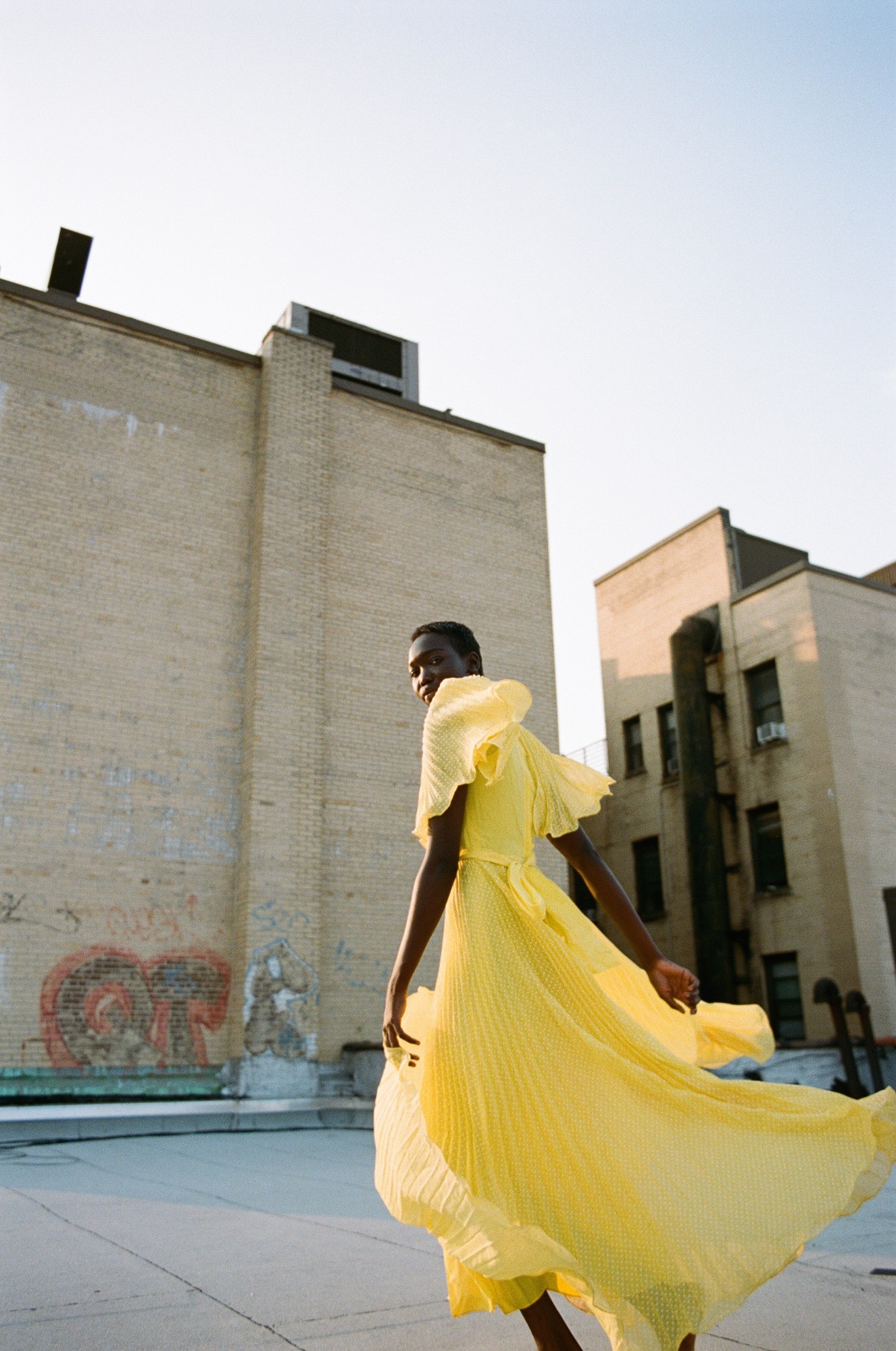 a model on the roof in new york photographed by sabrina santiago