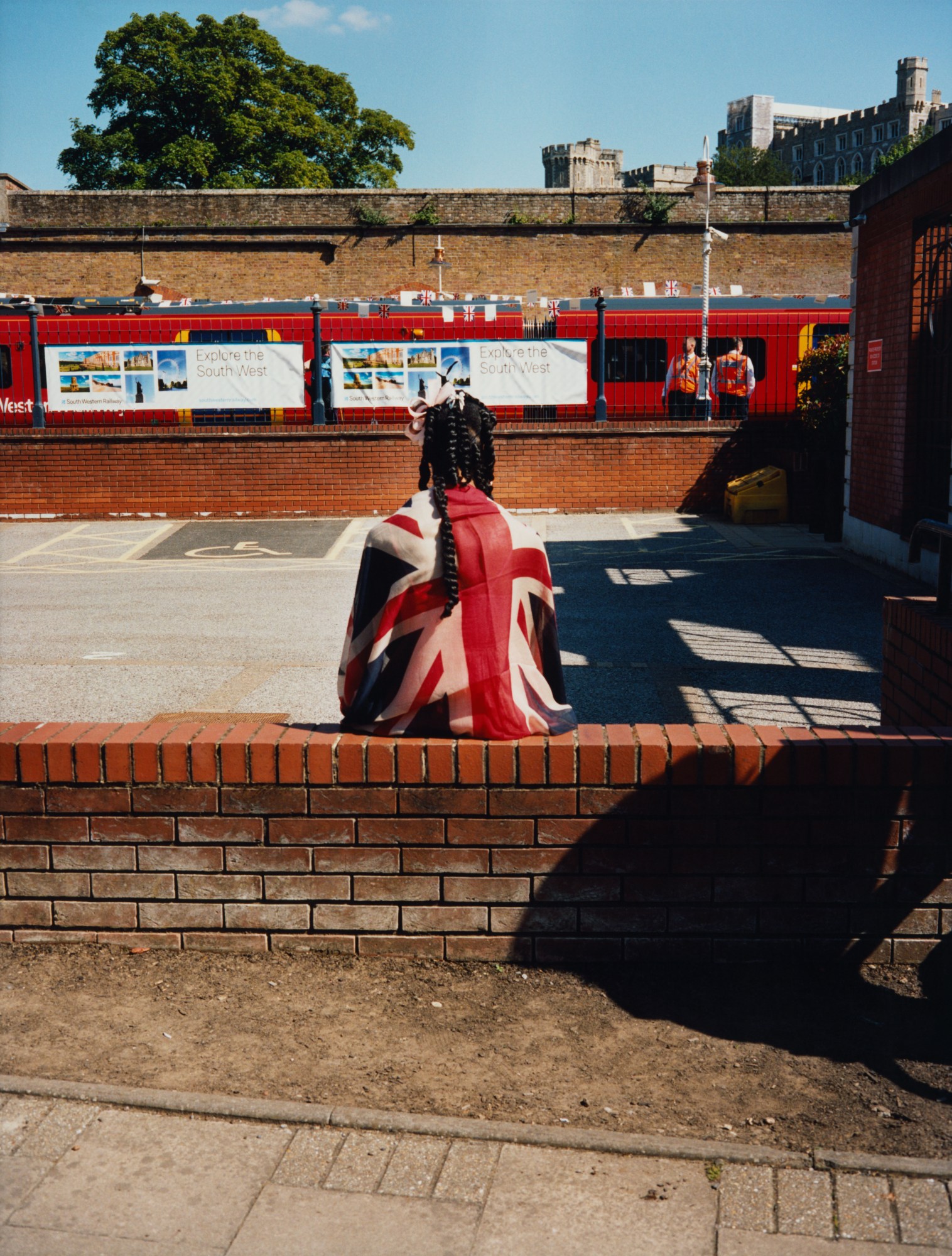 maxwell tomlinson photographs a woman wearing a union jack flag