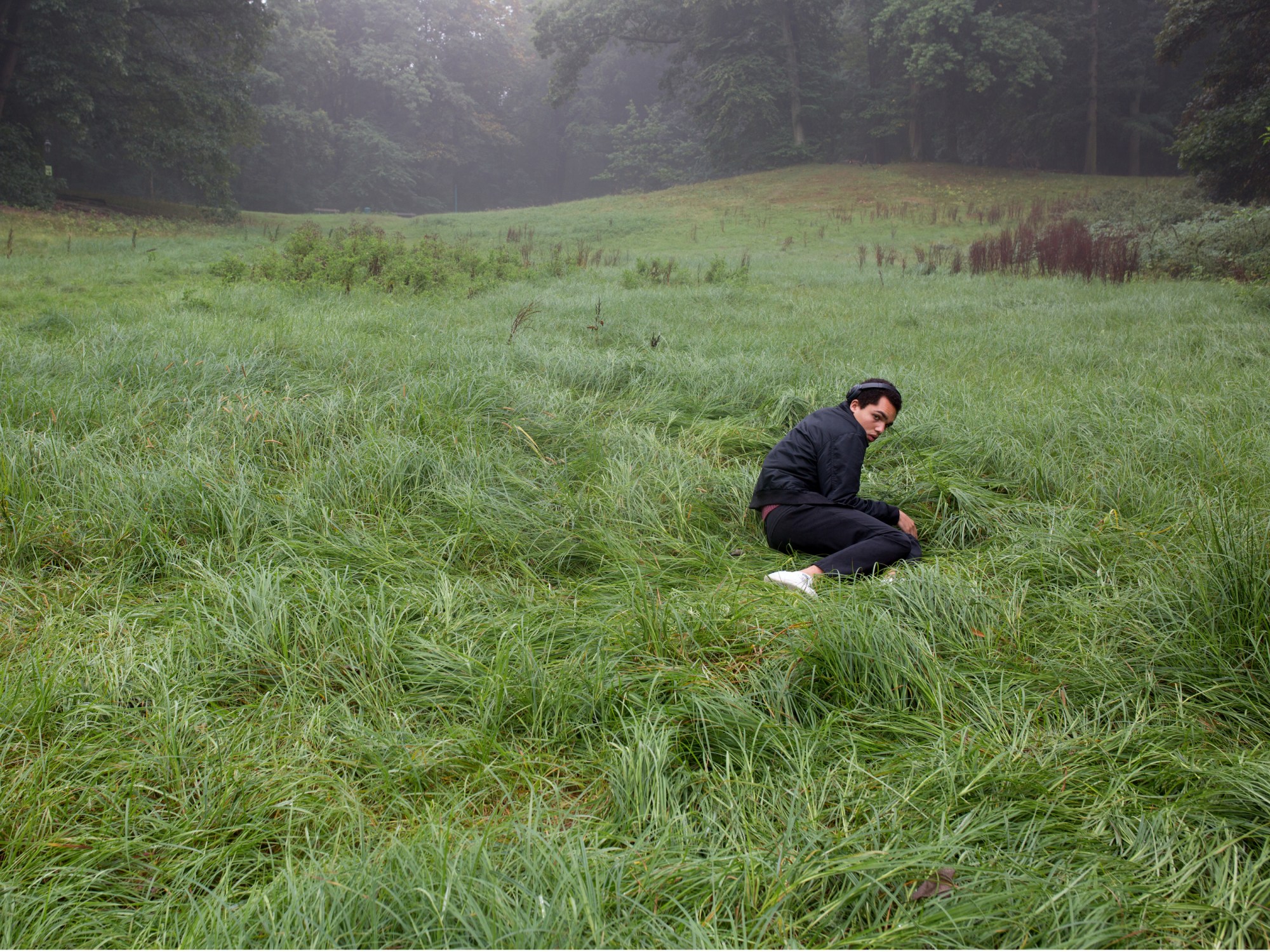 david uzochukwu lying in a field