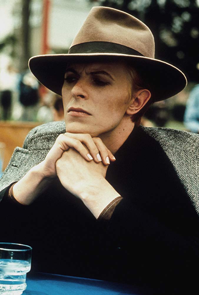 David Bowie with a hat on in The Man Who Fell To Earth by Nicolas Roeg