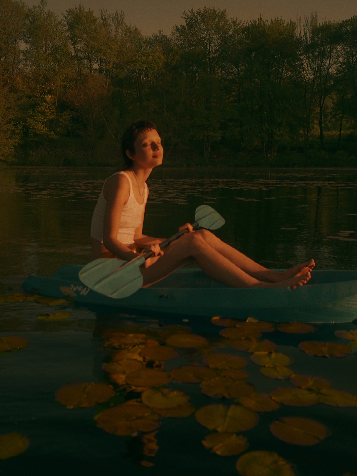 zachary chick photographs a girl paddling in a pond