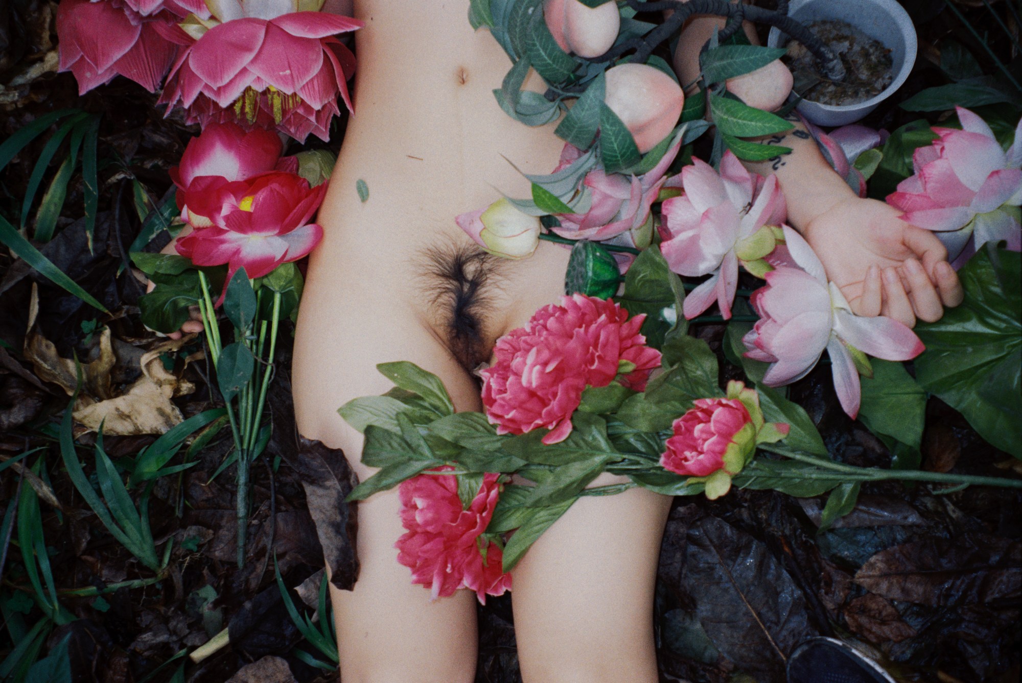 luo yang photographs a girl naked lying amongst flowers