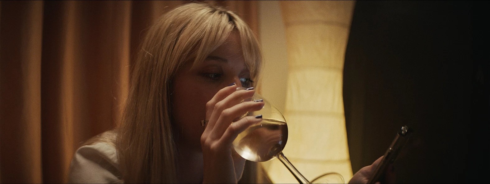 Woman with a glass of white wine