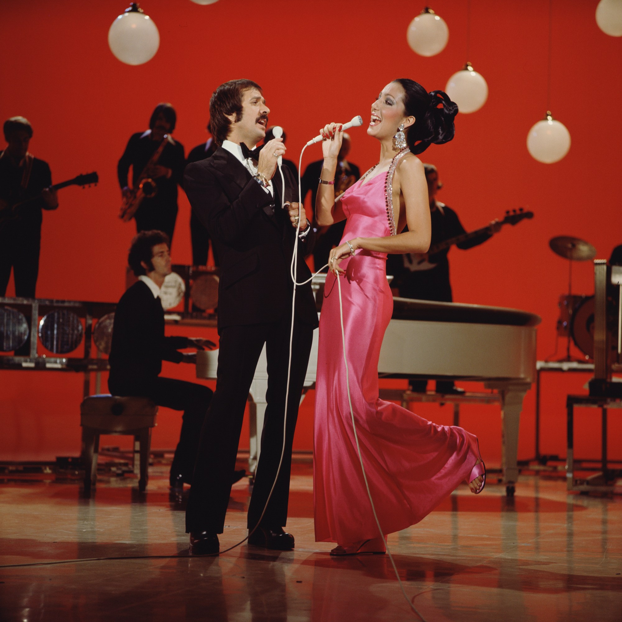 sonny and cher singing on stage for the sonny & cher show in a pink dress