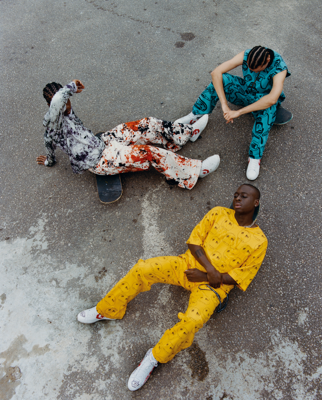 Three men on skateboards, photographed from above