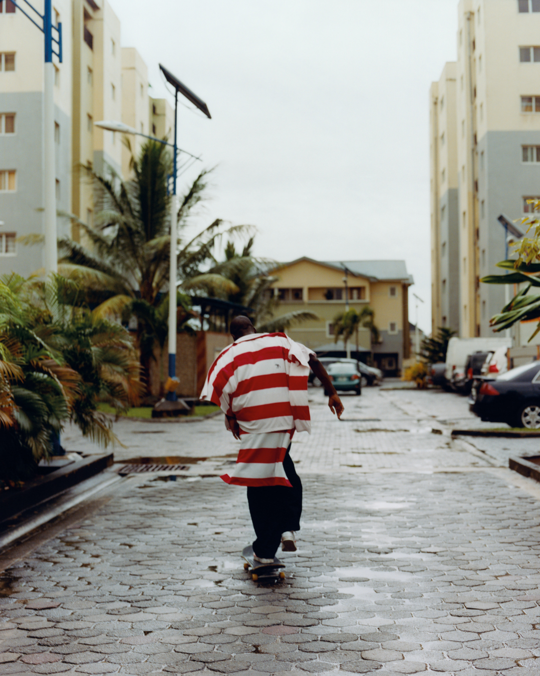 Man seen from behind on skateboard