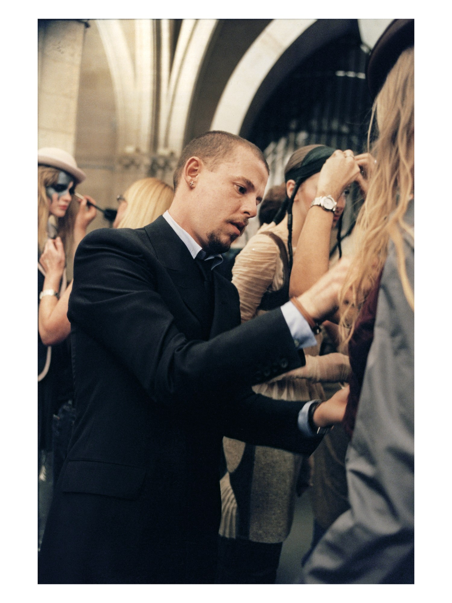 Alexander McQueen wearing a suit