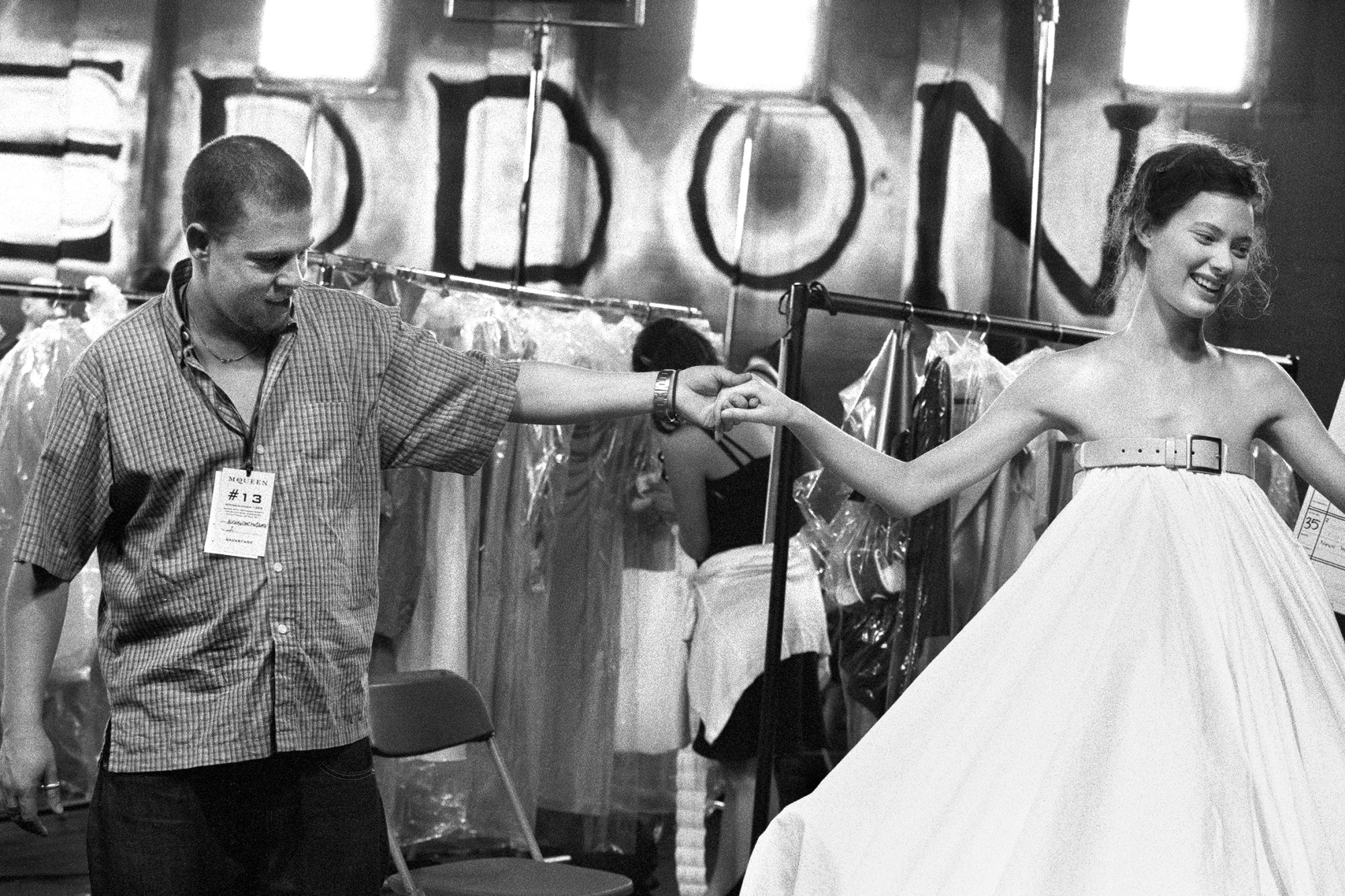 Alexander McQueen holding model's hand