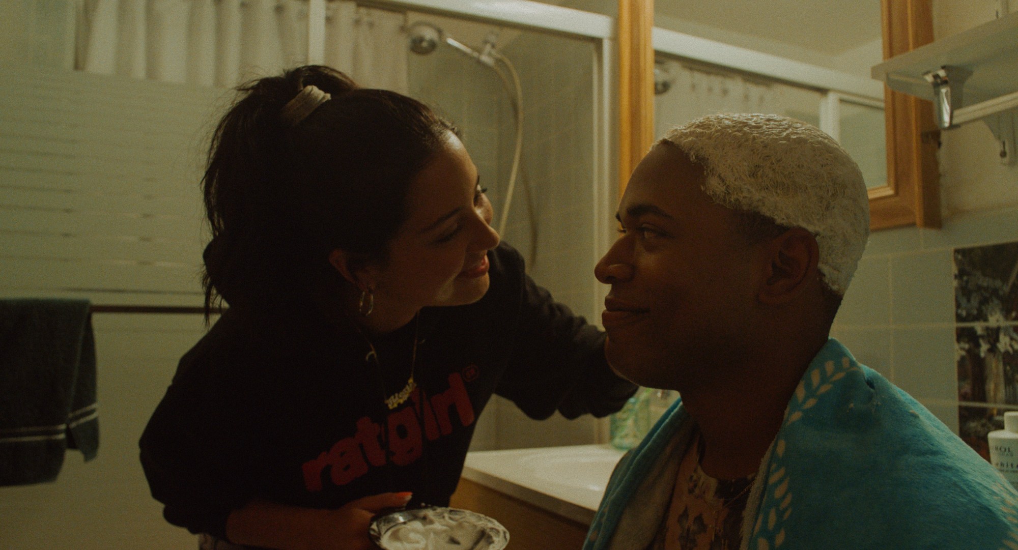 Alexa Demie bleaches Kelvin Harrison Jnr's hair in the film Waves