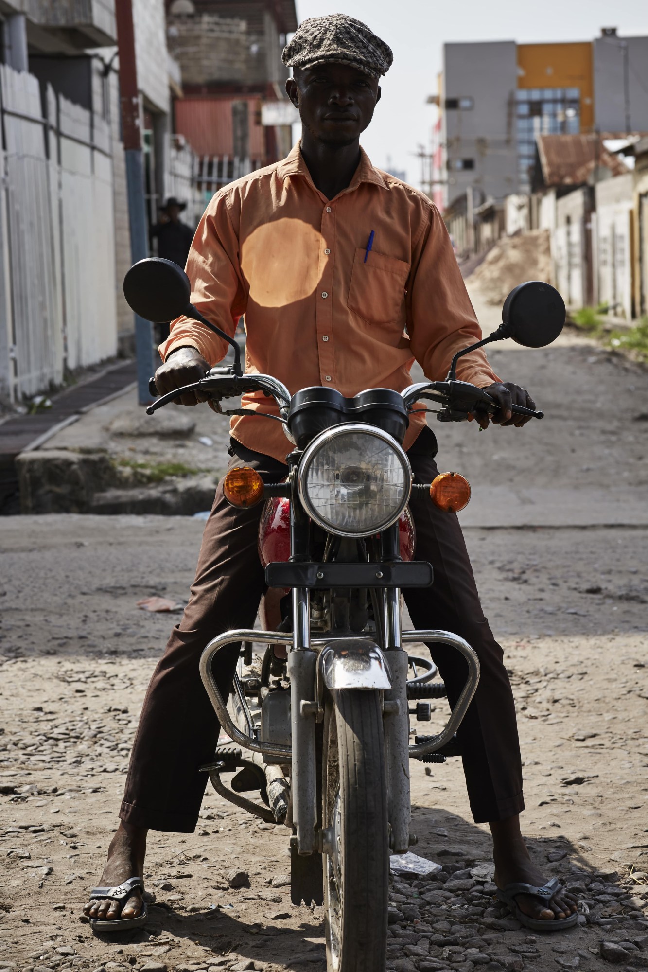 kinshasha congo motorcycle taxi rider street style