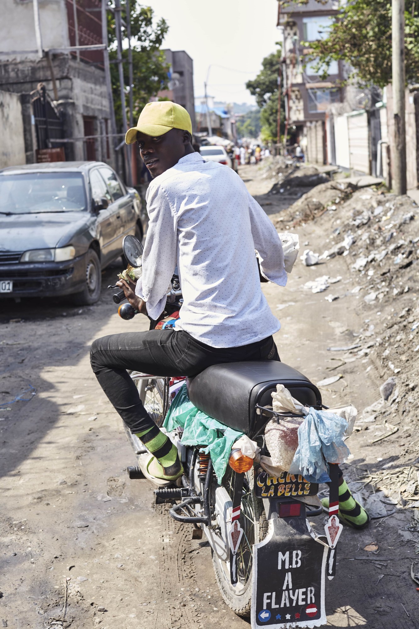 kinshasha congo motorcycle taxi rider street style