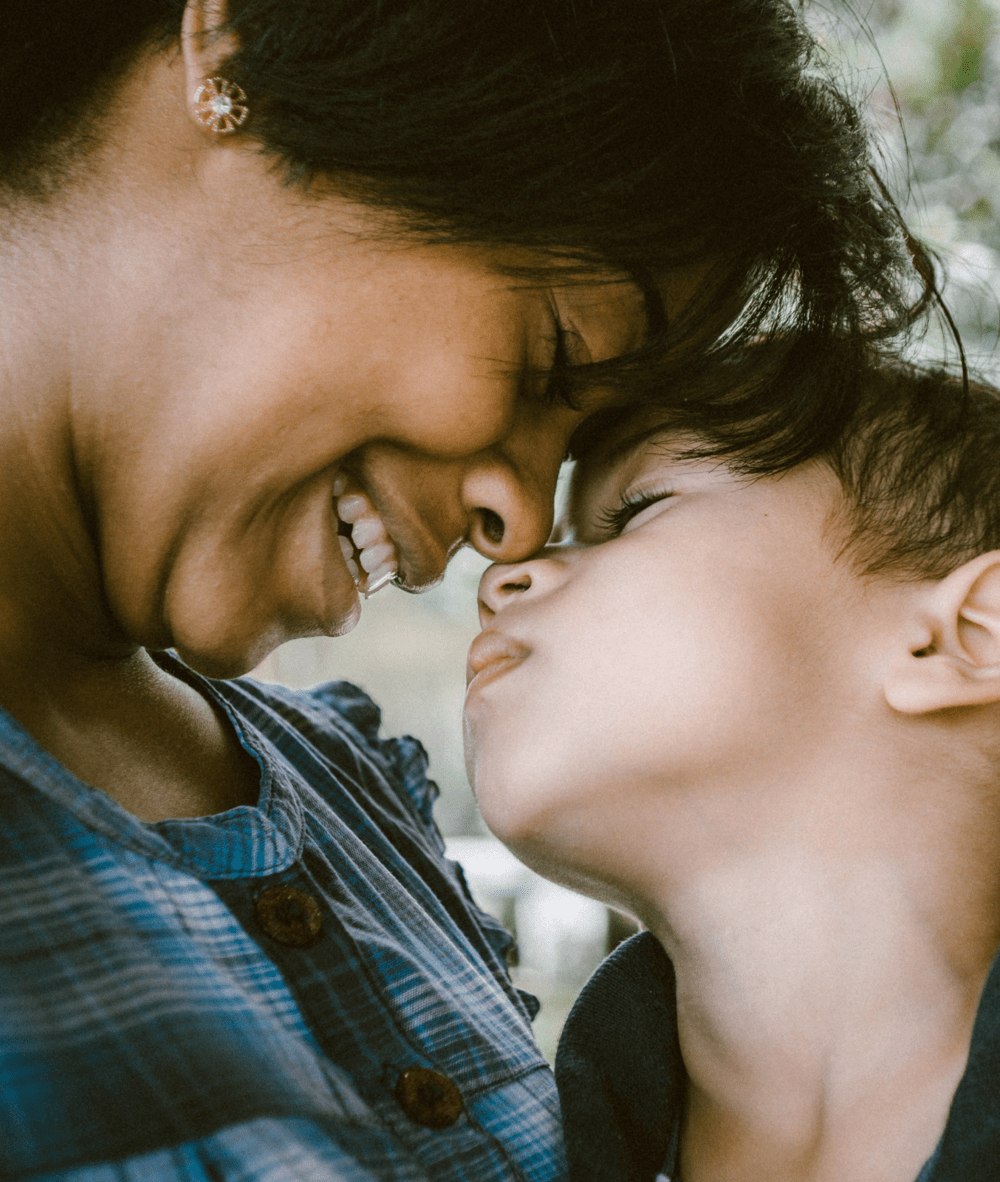 An image of a mother and son embracing.