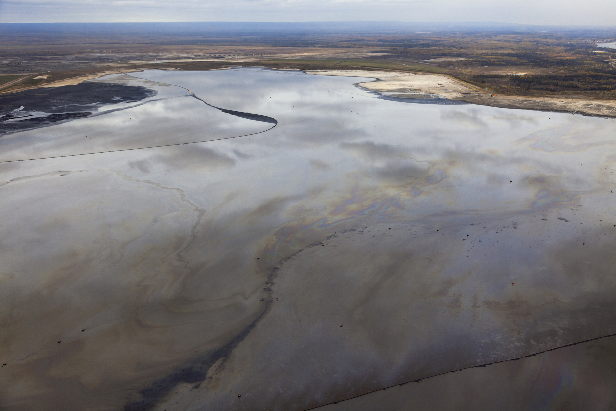 A tailings pools polluted with crude oil at a tar sands extraction site in Alberta, Canada.