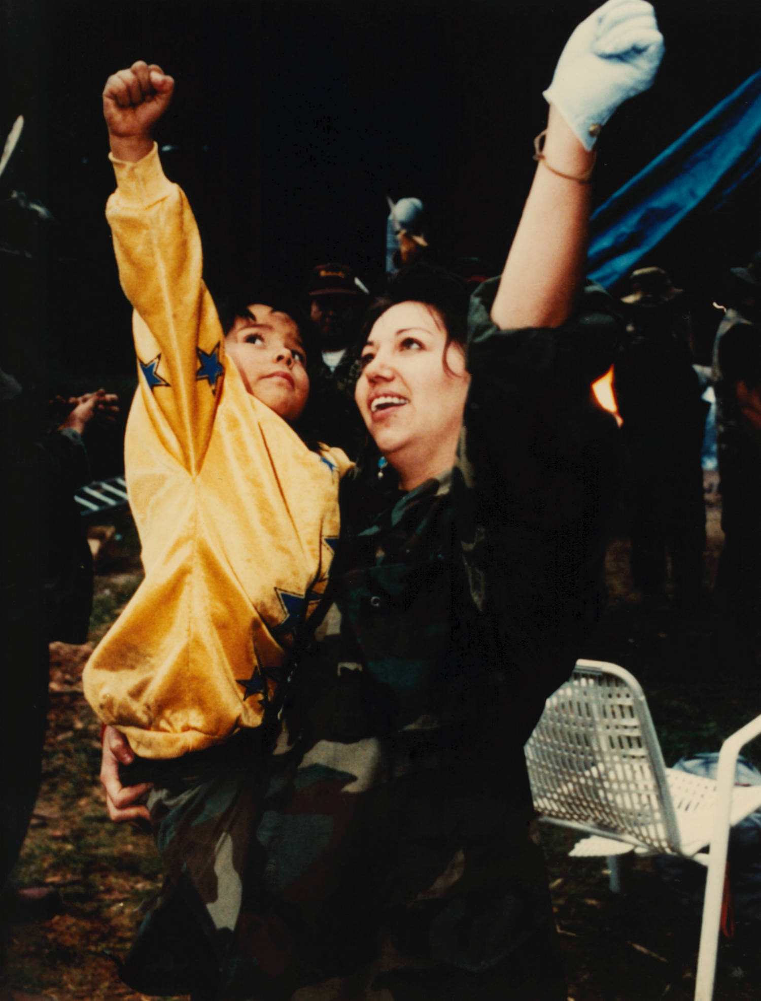 A mother and child raise their fists in protest during the Oka Crisis in Quebec, Canada.