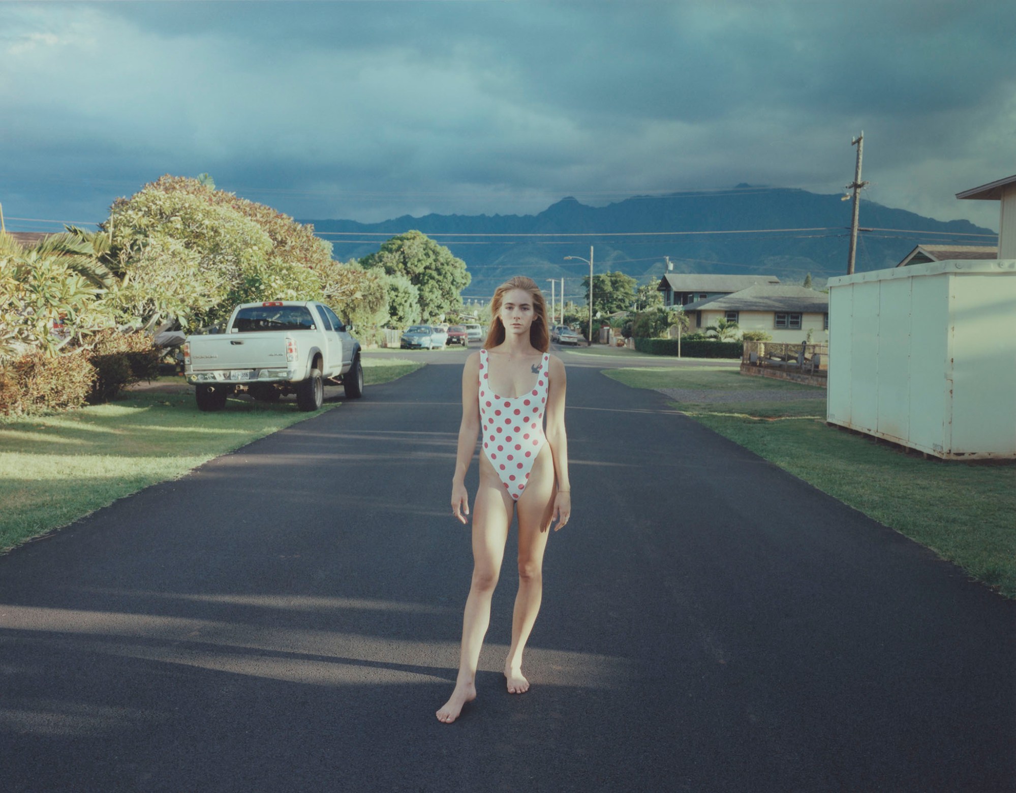 Woman in swimsuit standing in the street in Hawaii