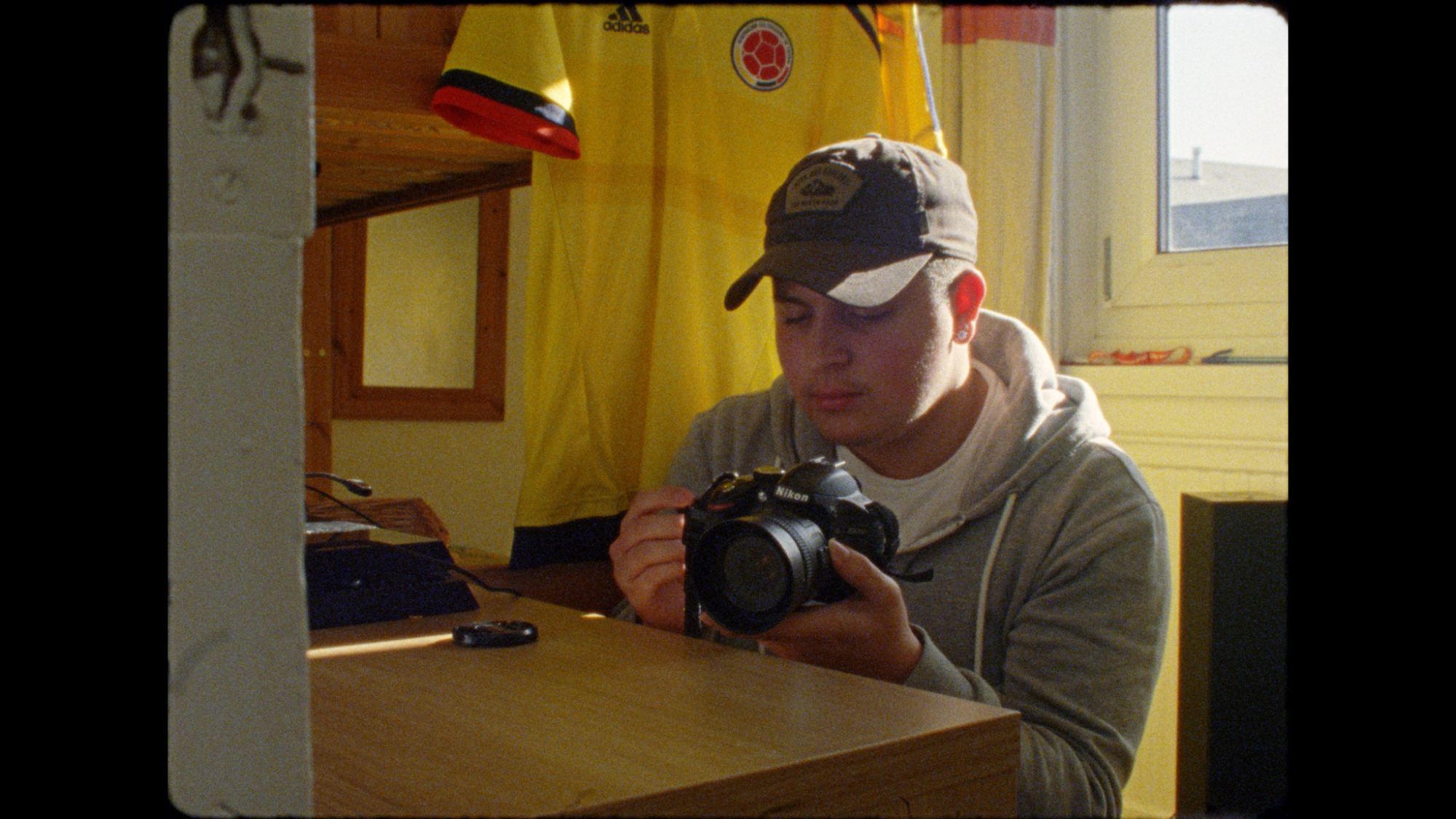 latino boy looks at camera