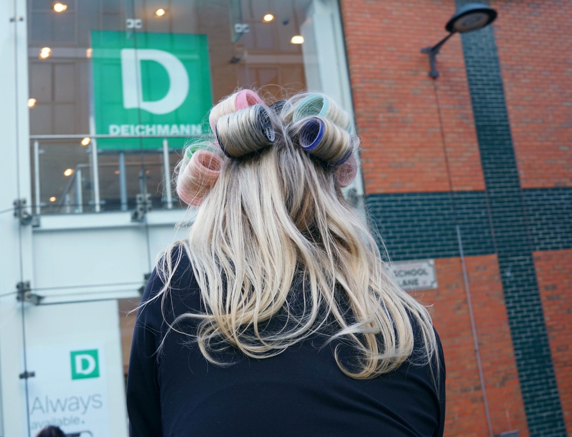 woman with rollers in her hair