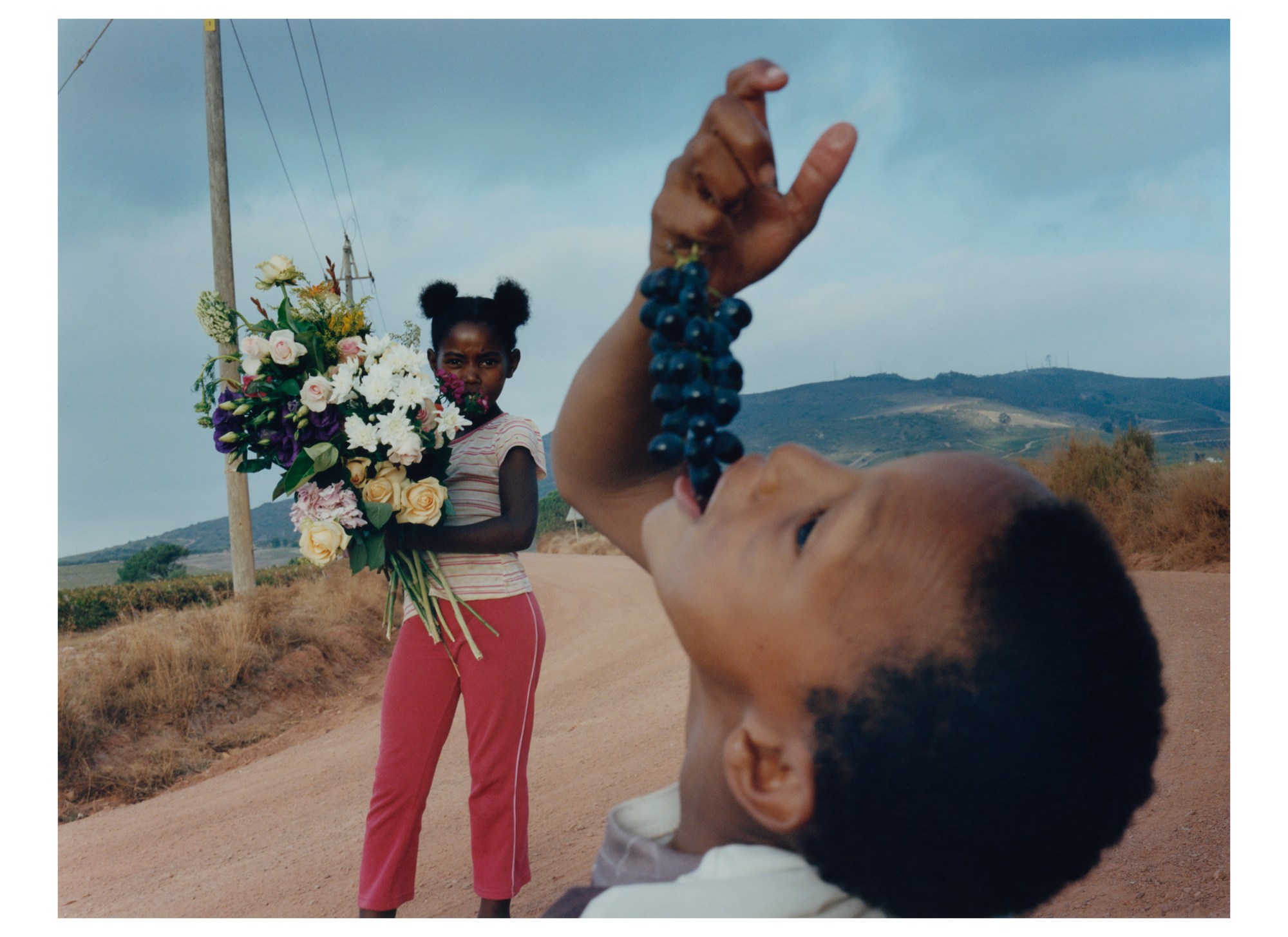 child eating grapes