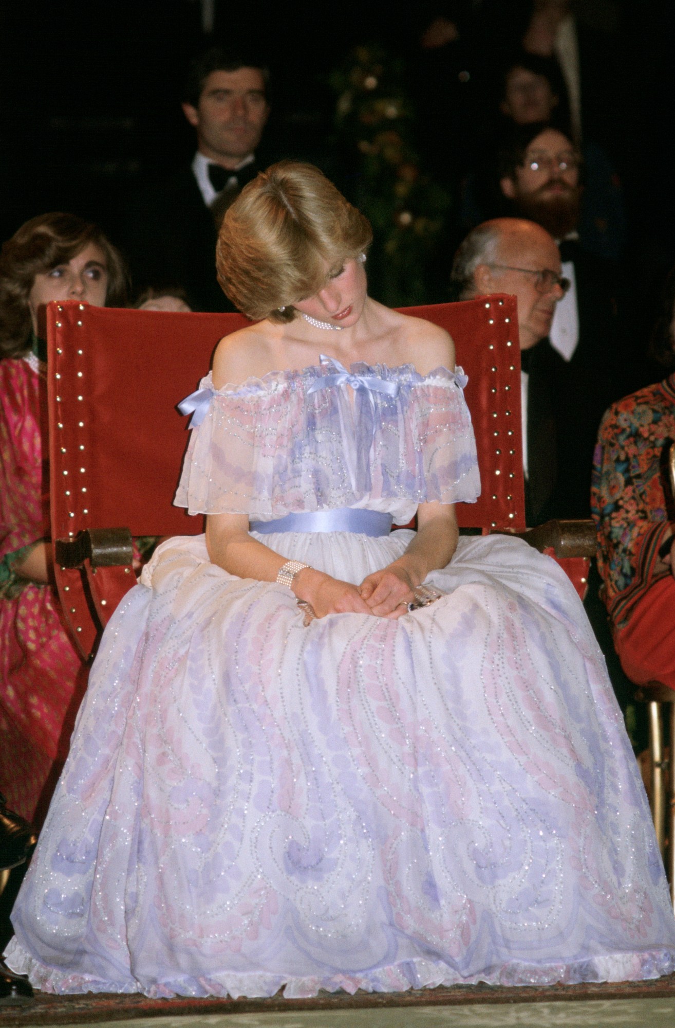 a portrait of princess diana napping while sitting up in a lilac ballgown