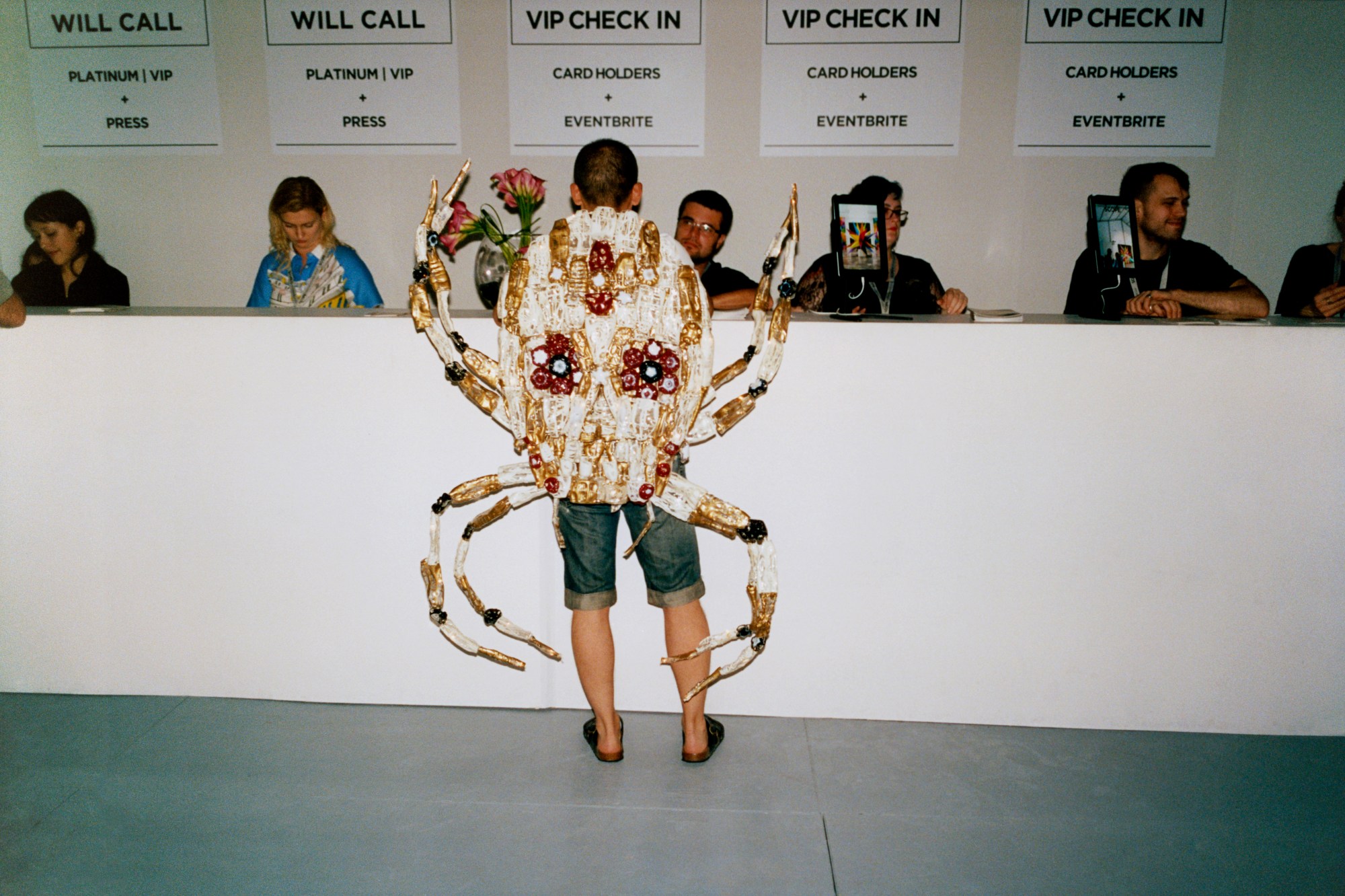 a man wearing a crab outfit at art basel