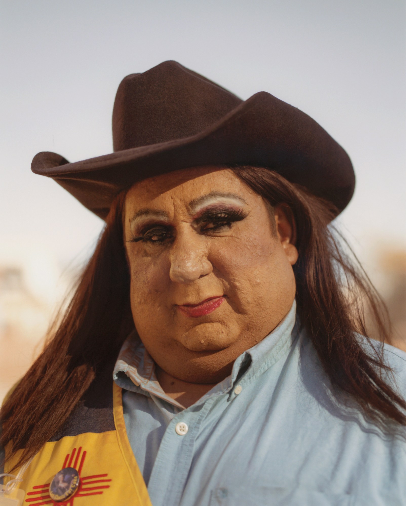 a queer cowgirl wearing a stetson