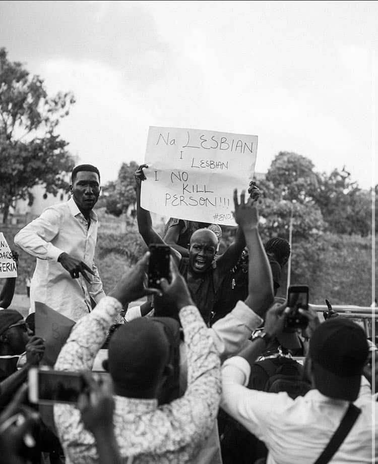 Queer Nigerian activist Amara protesting in #EndSARS protests