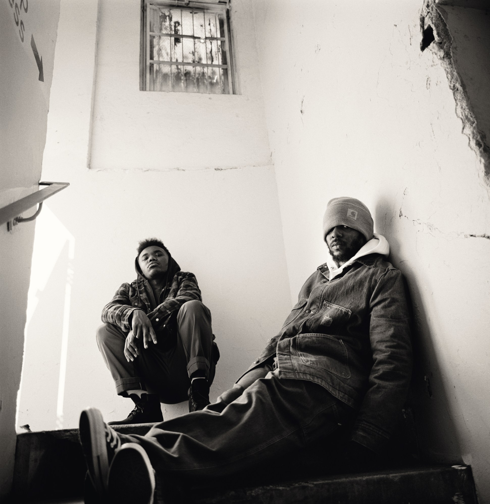 Kendrick Lamar and Baby Keem sitting in a stairwell – shot by Glen Luchford for i-D magazine 2020