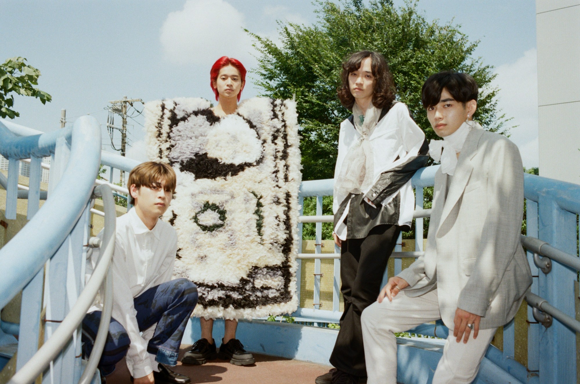 Photo of four models shot by Tsukasa Kudo