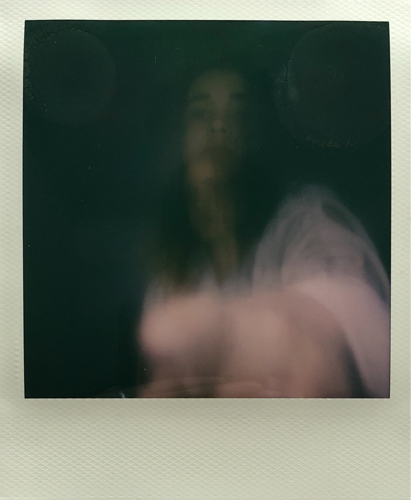 blurry polaroid of a woman