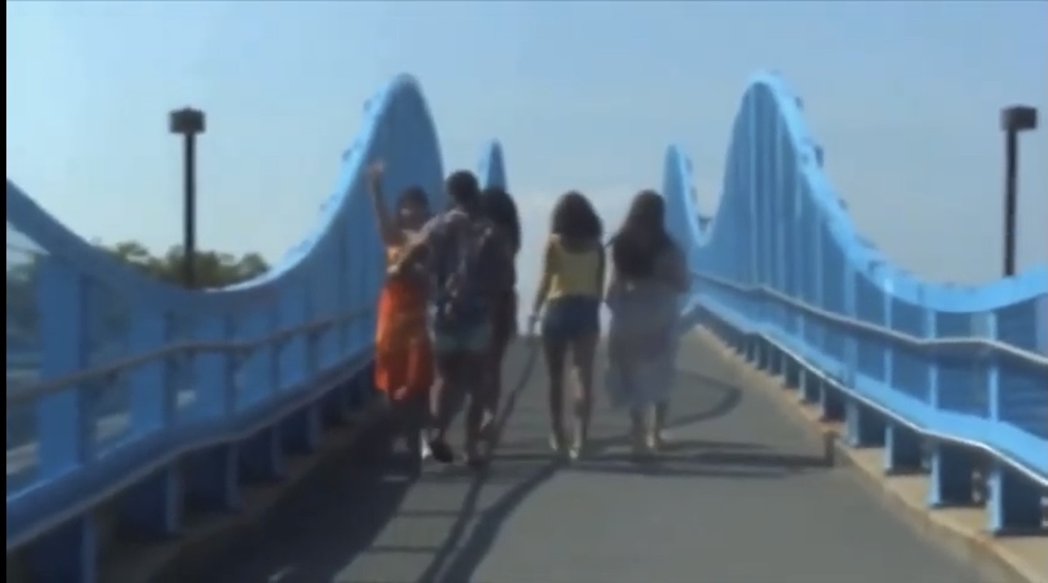 a group walking across a bridge