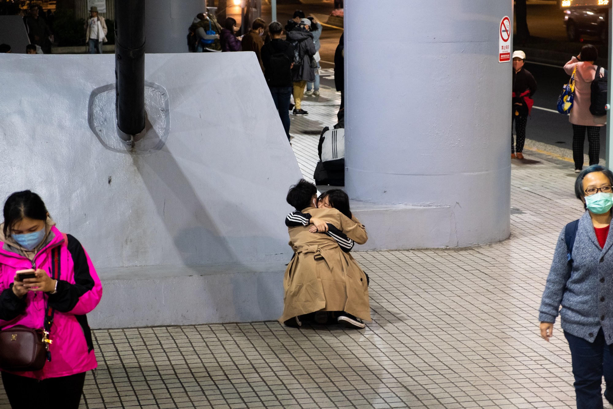 two people hugging on the floor