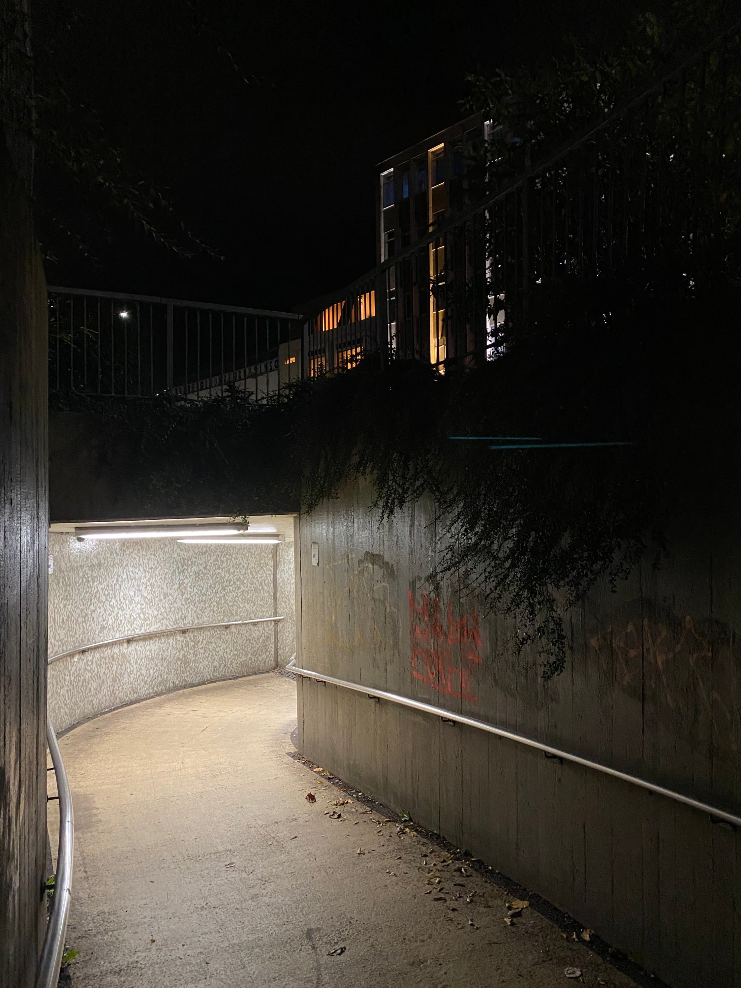 an underpass lit up at night