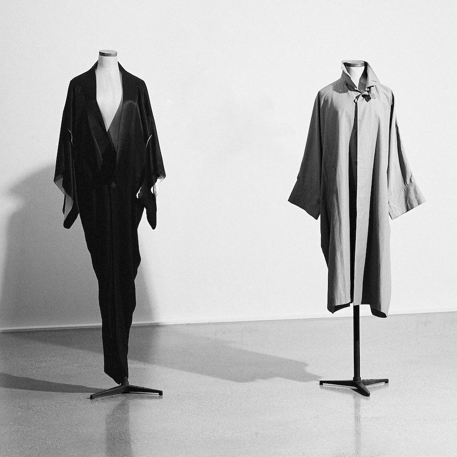 Left: John Galliano Black Kimono Dress Right: Issey Miyake Oversized Raincoat 1979