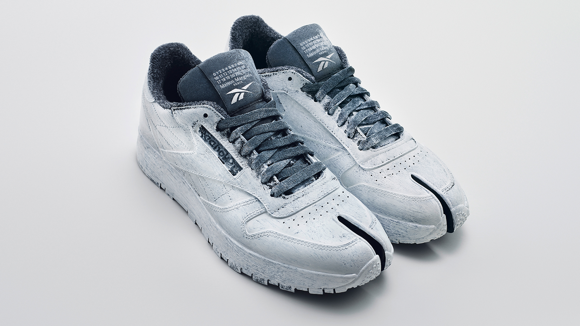 Maison Margiela x Reebok - Bianchetto Tabi Classic Leather - 1920X1080.jpg