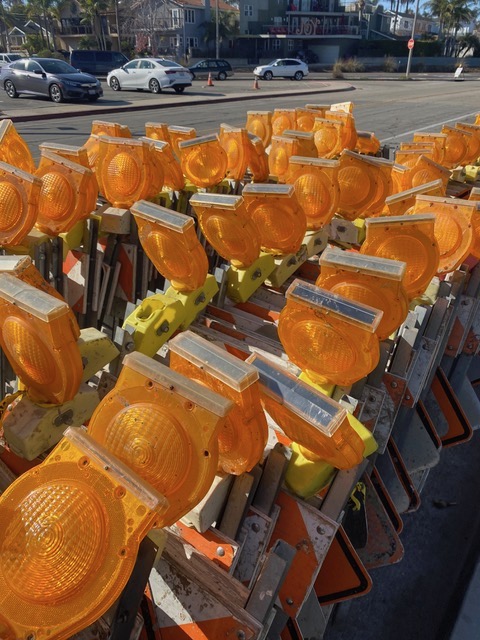 traffic light signs piled up on the road