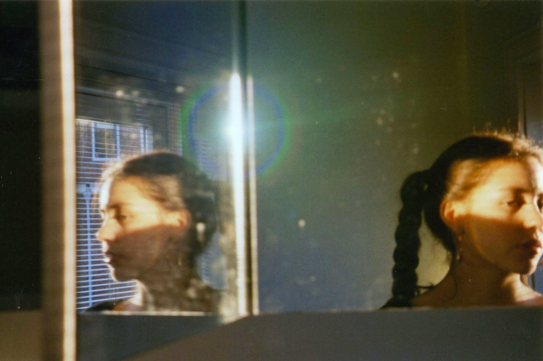 a woman photographing her reflection