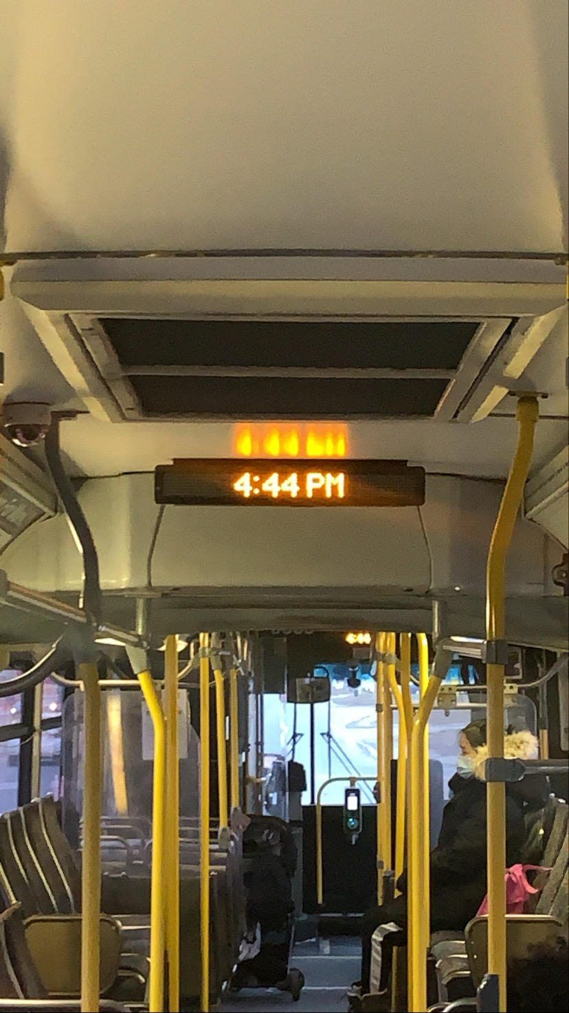 a bus clock reading the time 4:44