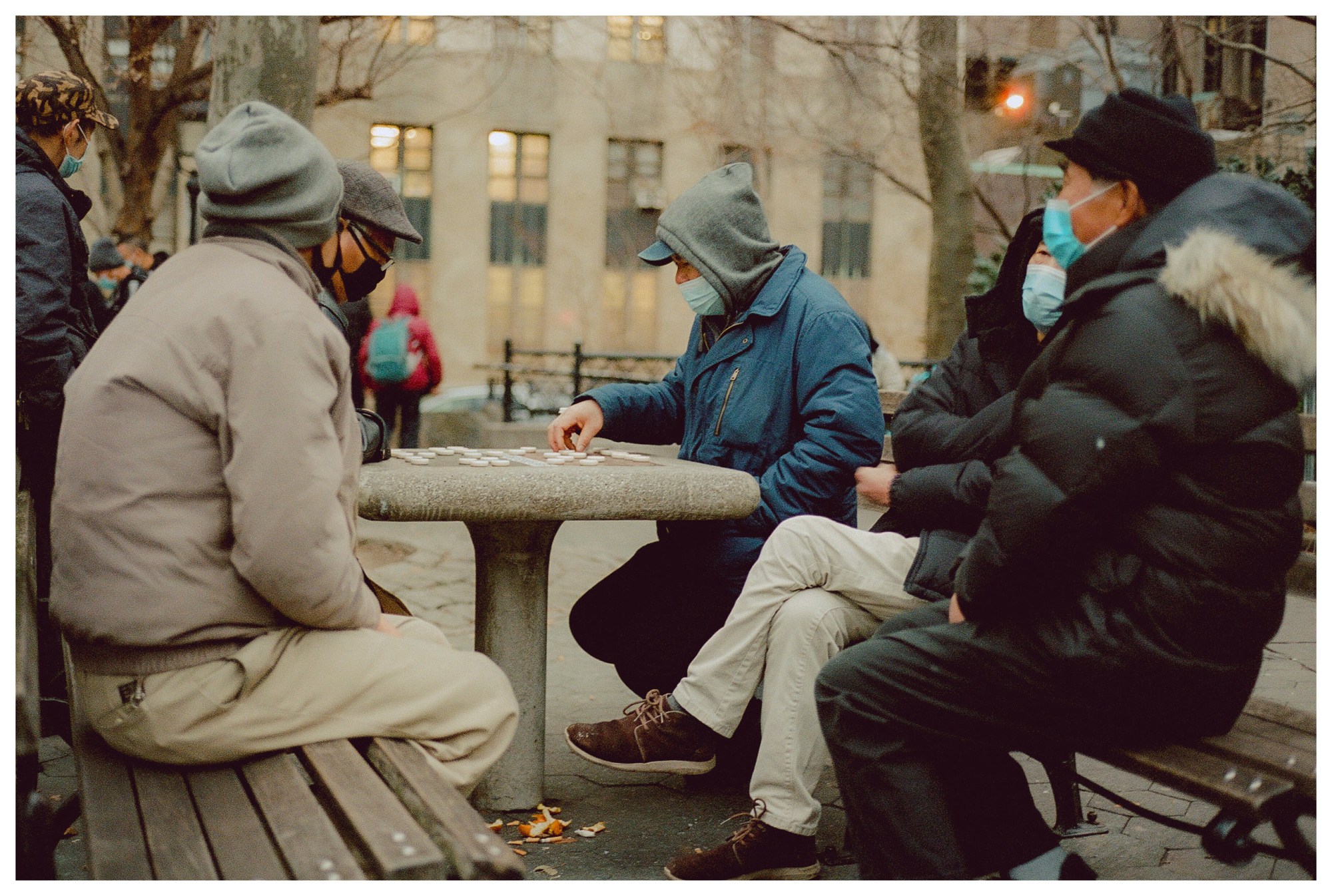 men playing a board game outside